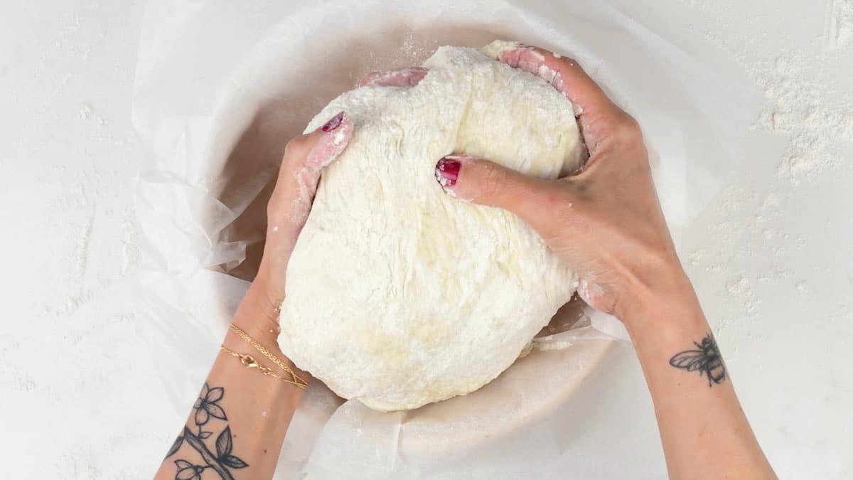 putting loaf into bowl for second rise