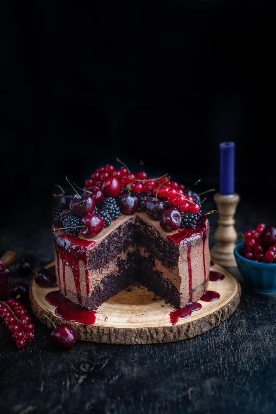 Vegan chocolate cake with large slice cut out