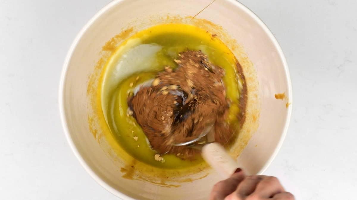 mixing spices into cookie dough batter