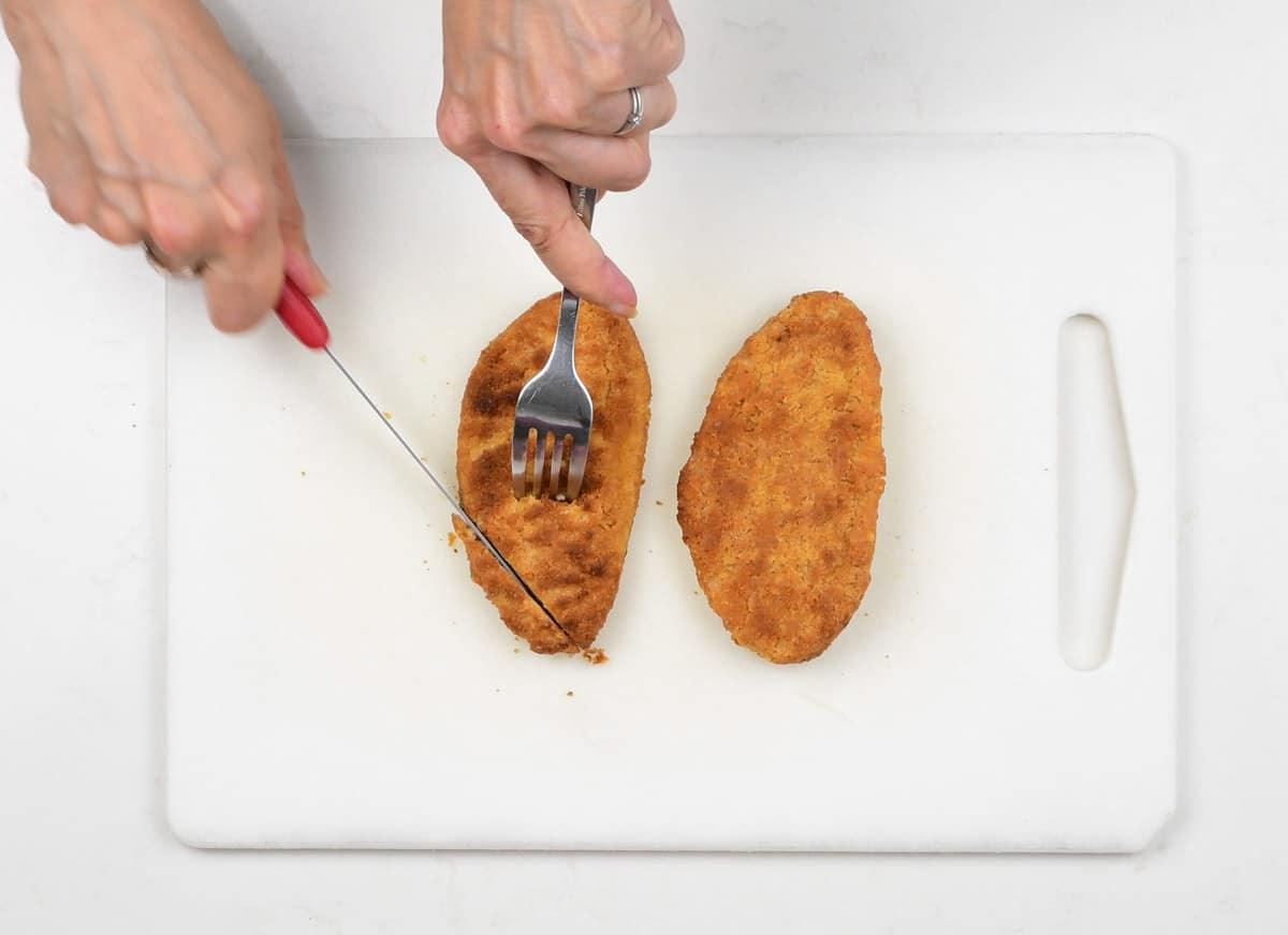 slicing vegan chicken cutlets