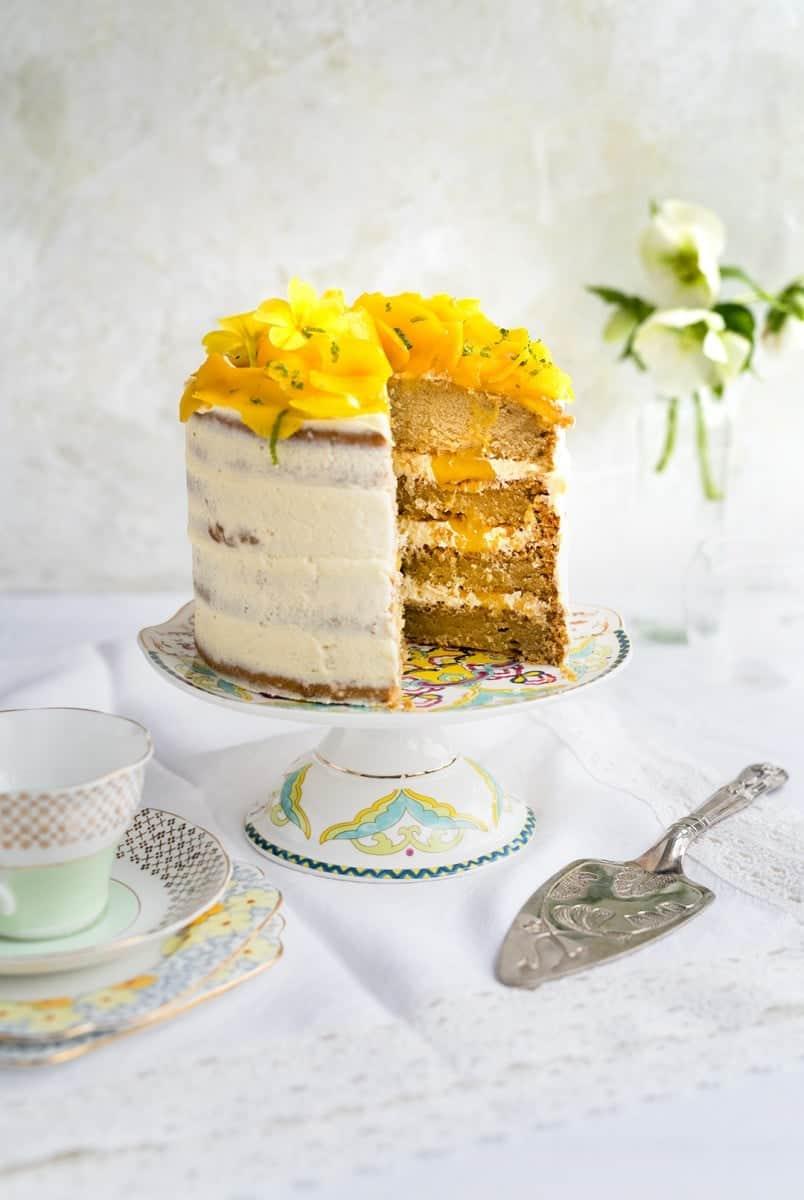 Beautiful vegan tropical celebration cake with slice taken out