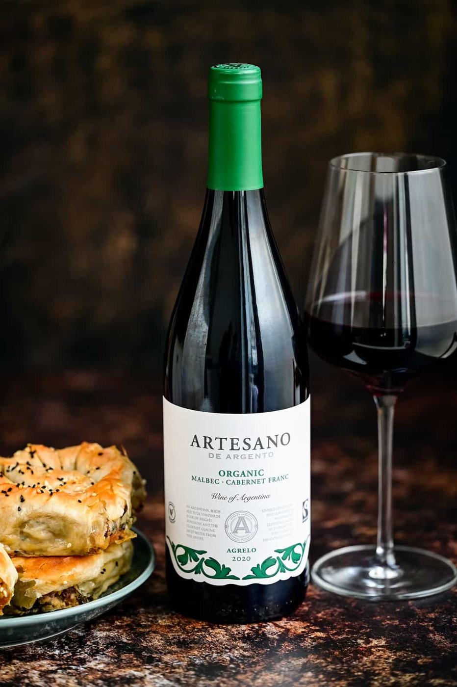 Artesano De Argento Malbec with wine glass on the side