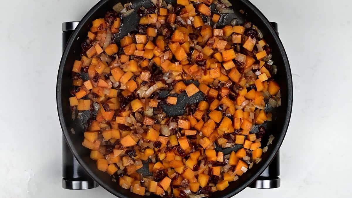 Vegan pie filling cooking in a skillet