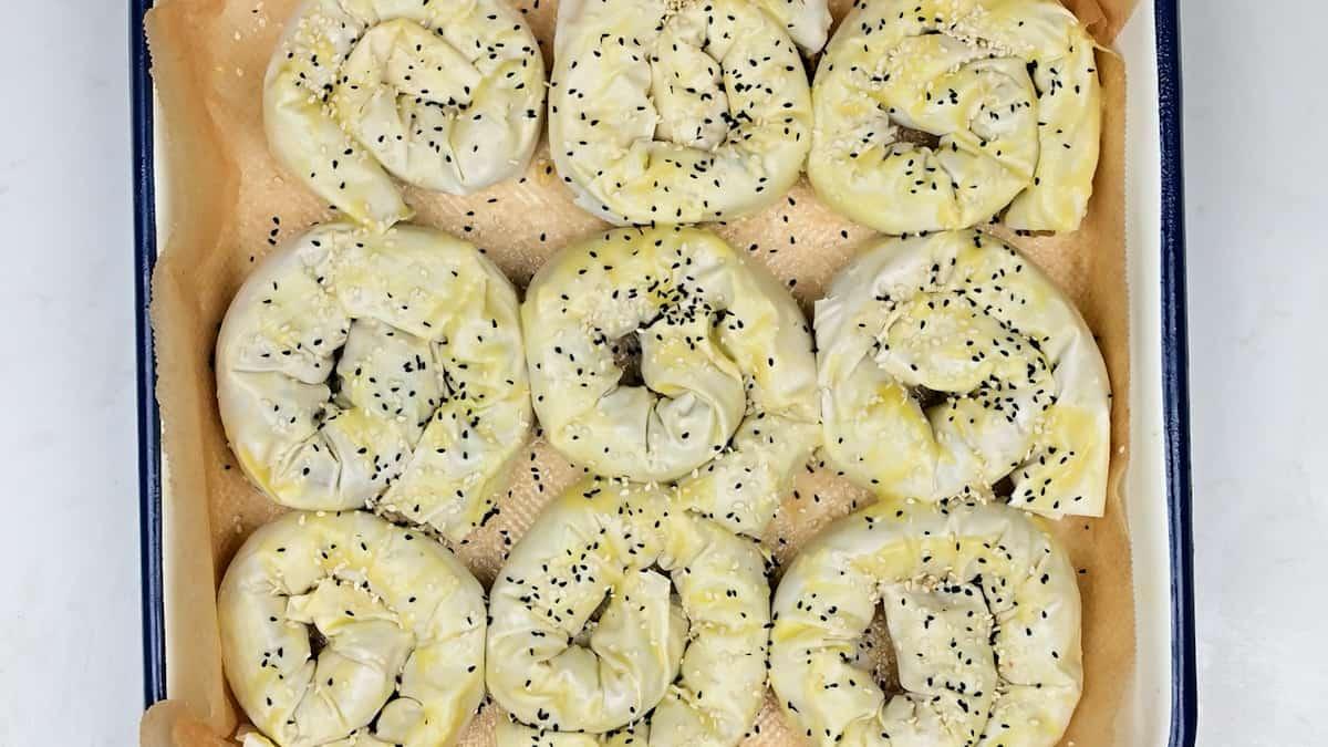 Vegetable Filo Pies twisted into spirals on baking tin
