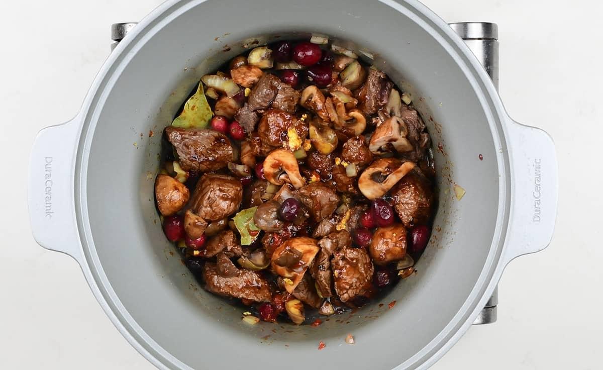 ingredients for venison stew in a slow cooker