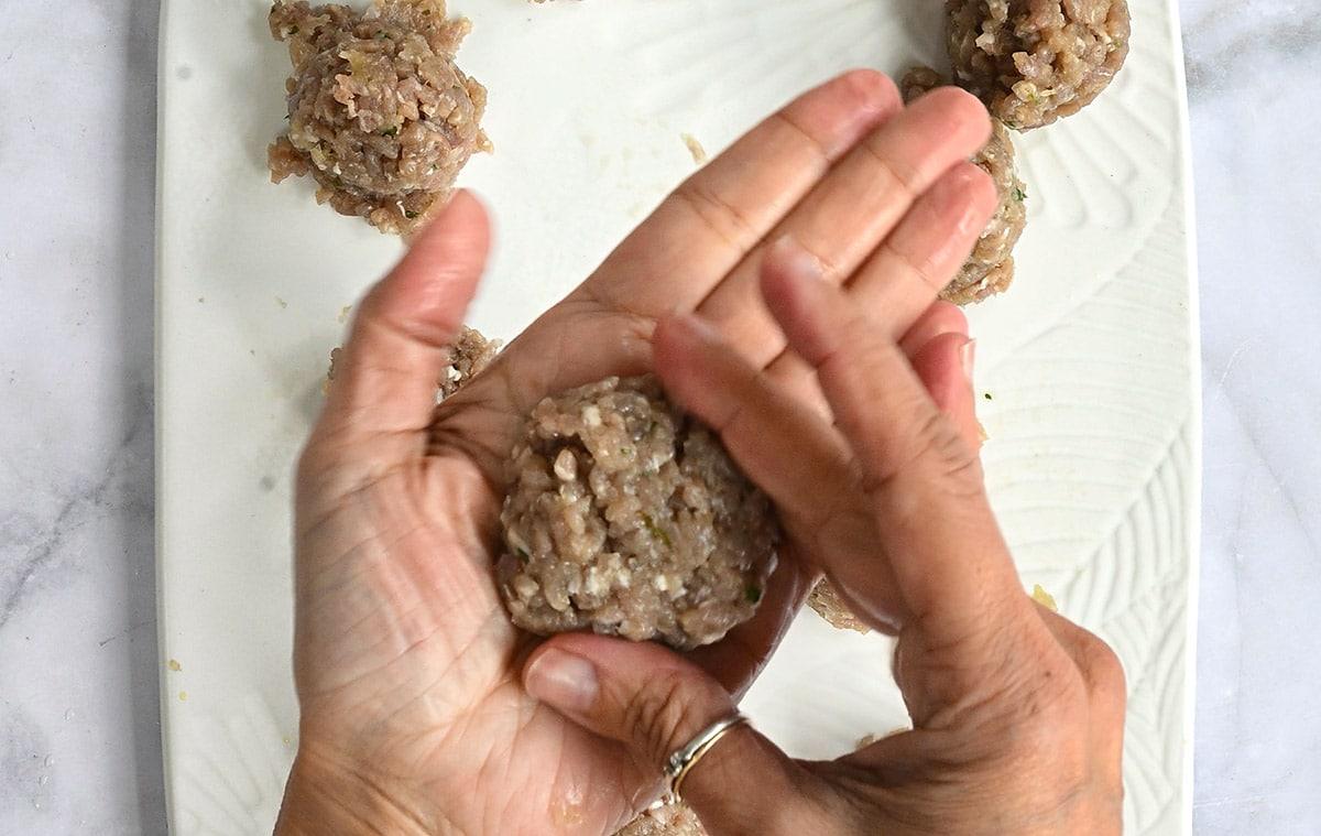shaping Vietnamese pork meatballs