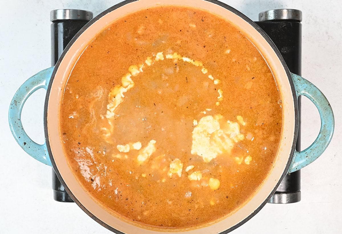 stirring cream into soup