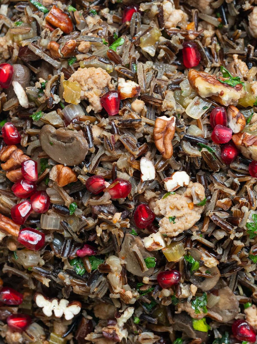 extreme close up on wild rice stuffing with sausage and mushrooms