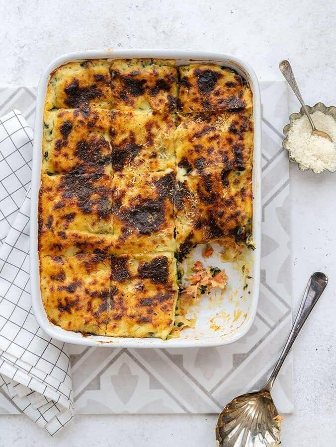 Seafood lasagne with canned salmon and spinach in an ovenproof dish
